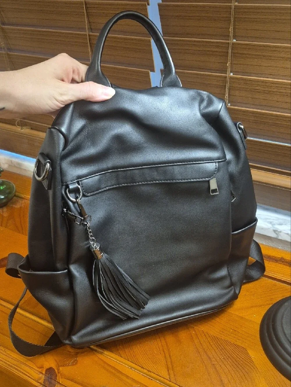 Classic Black Faux Leather Backpack with Tassel Accent